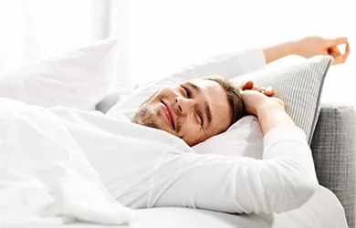 Man stretching afre restful sleep